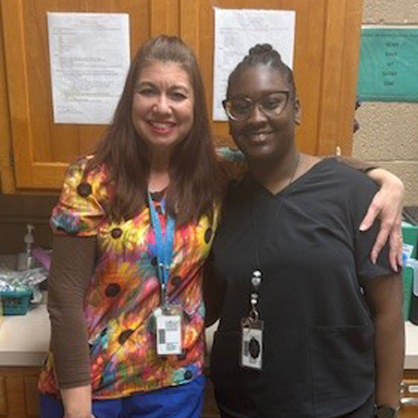Photo of school nurse Joanna Call and her clinic assistant, Tiffany Rogers, from Arlington ISD